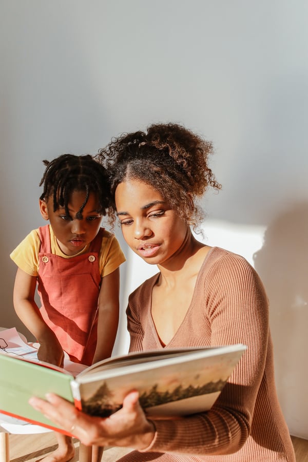 Mother and Child Looking at Picture Book